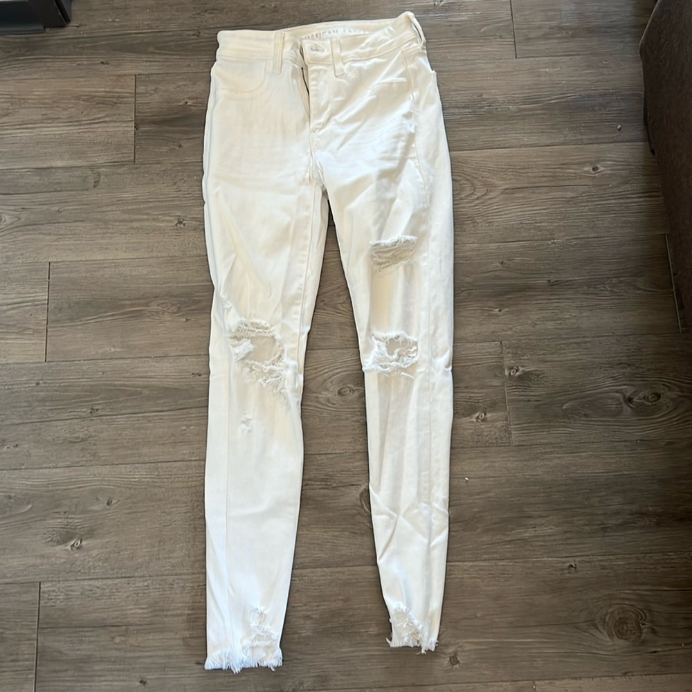 white jeans with rips